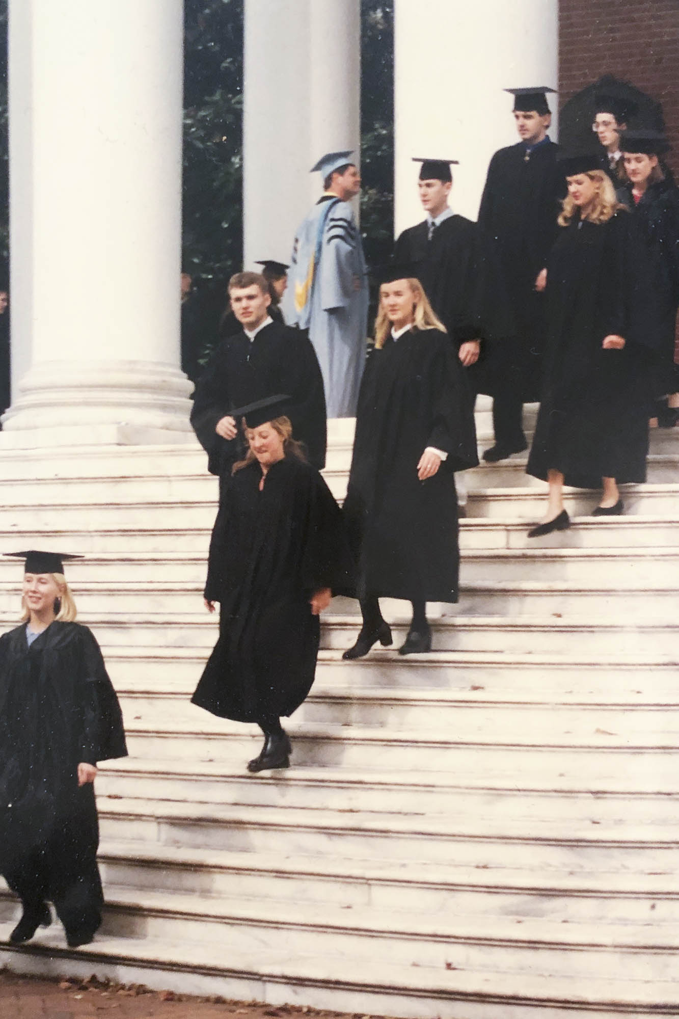 Tynan walking down the Rotunda steps during final exercises