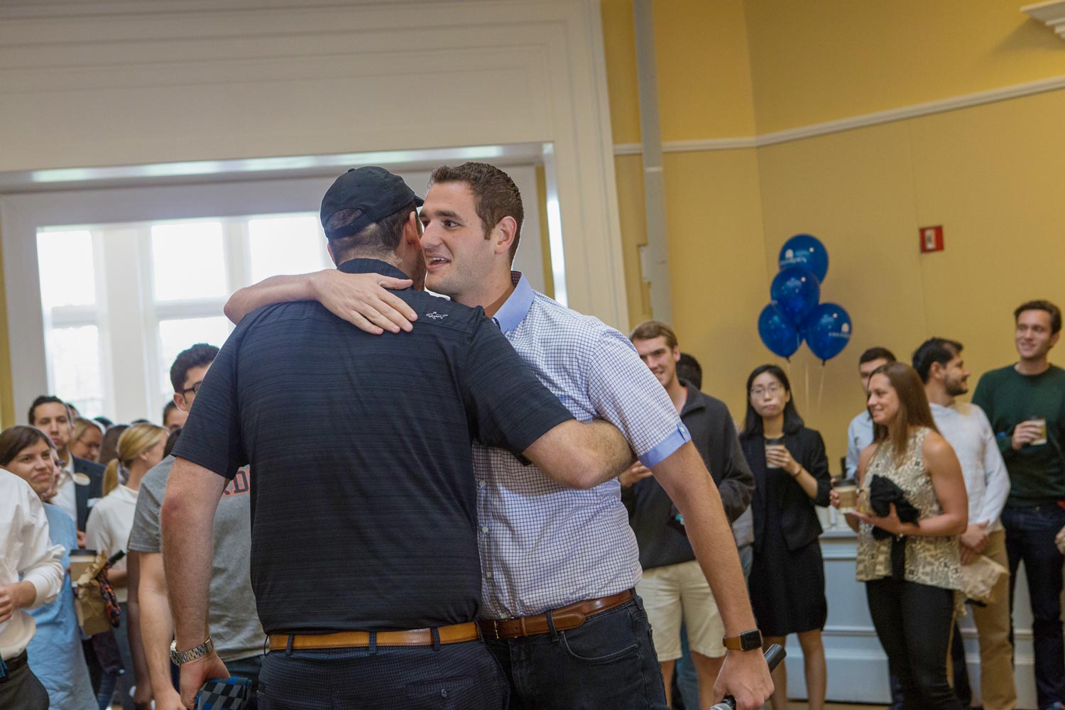 Dan Friedman hugs his twin brother Mike