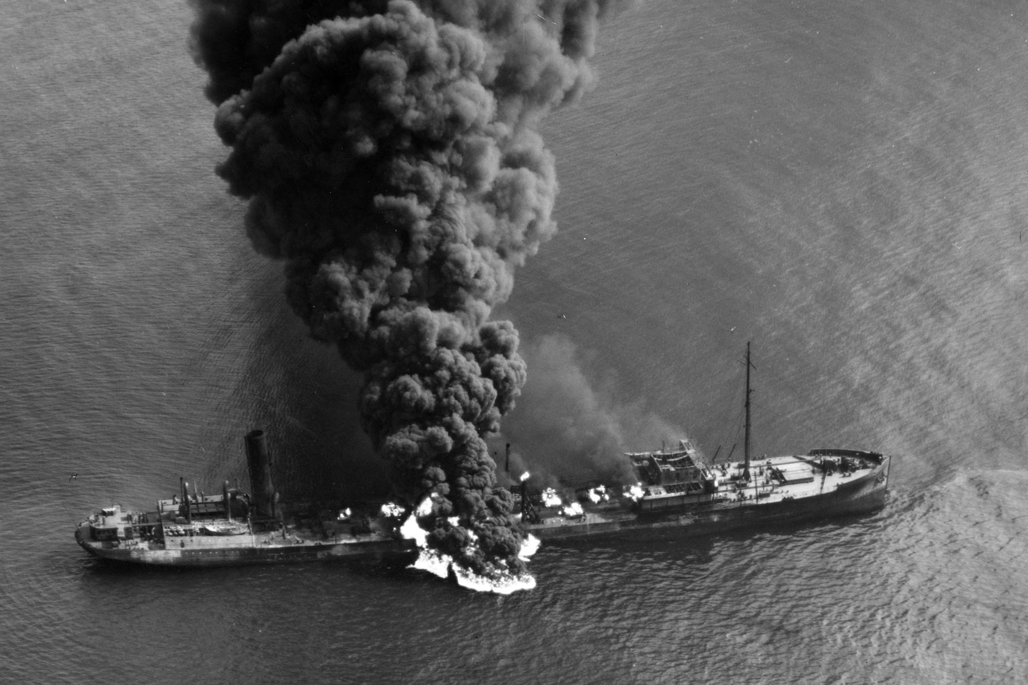  tanker Byron D. Benson smoke coming up from it after being struck by a torpedoe