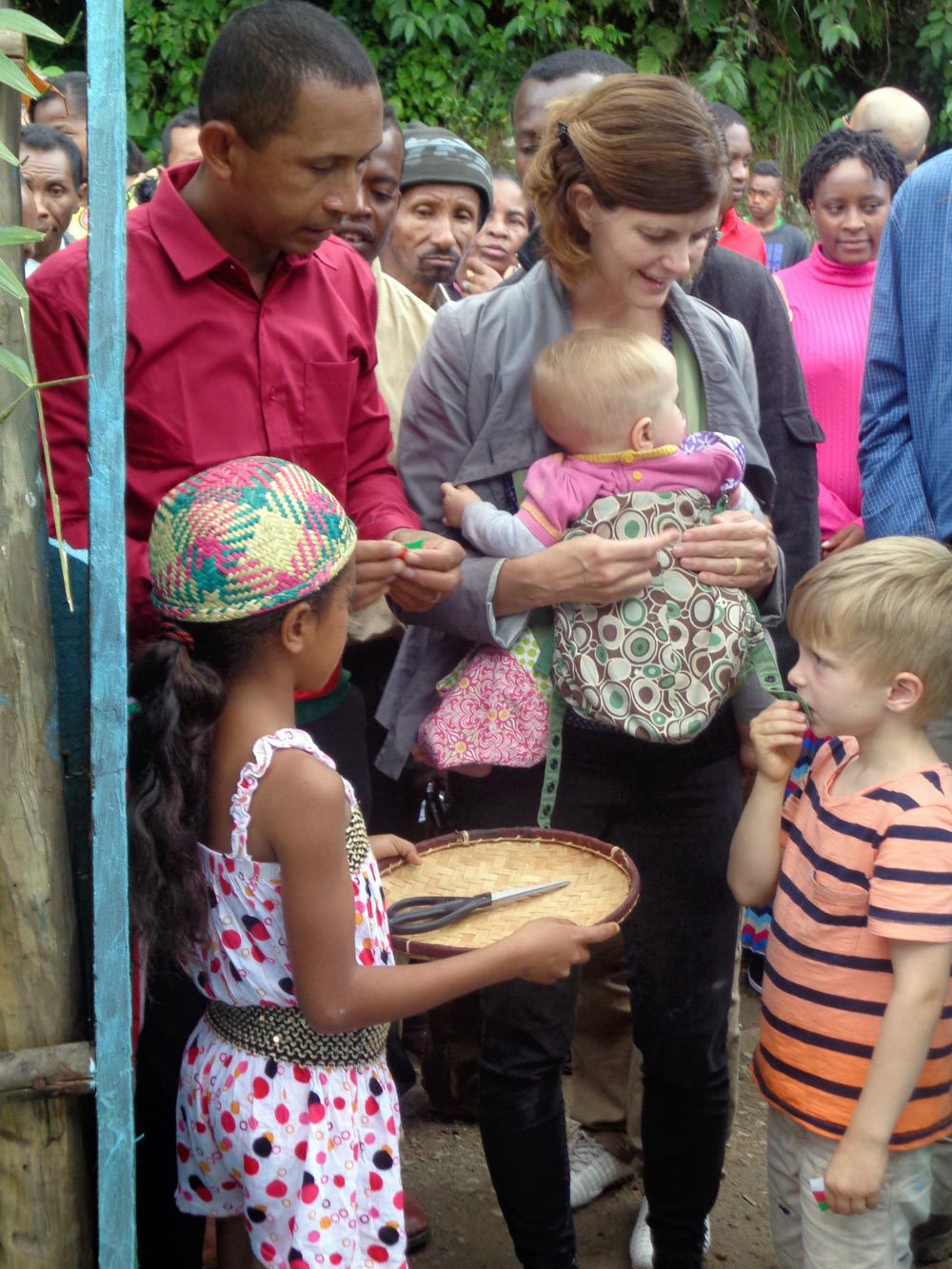 adults standing with children