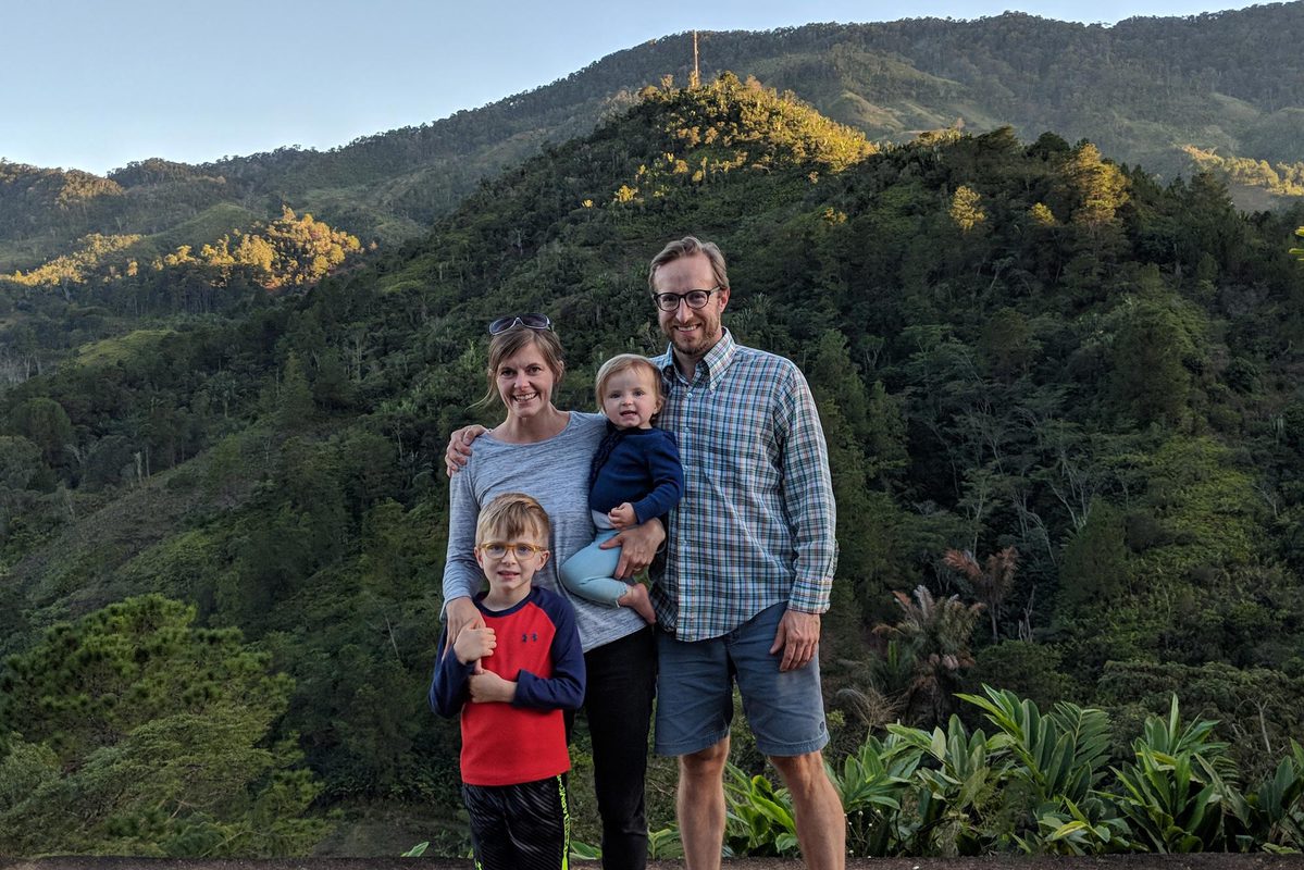 Tara Loyd and her family on top of a mountain