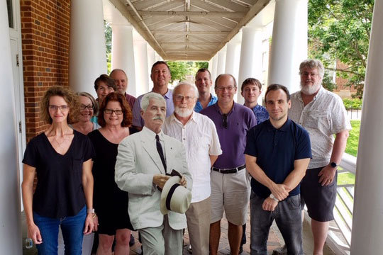 Group photo with a cardboard cutout of Faulkner