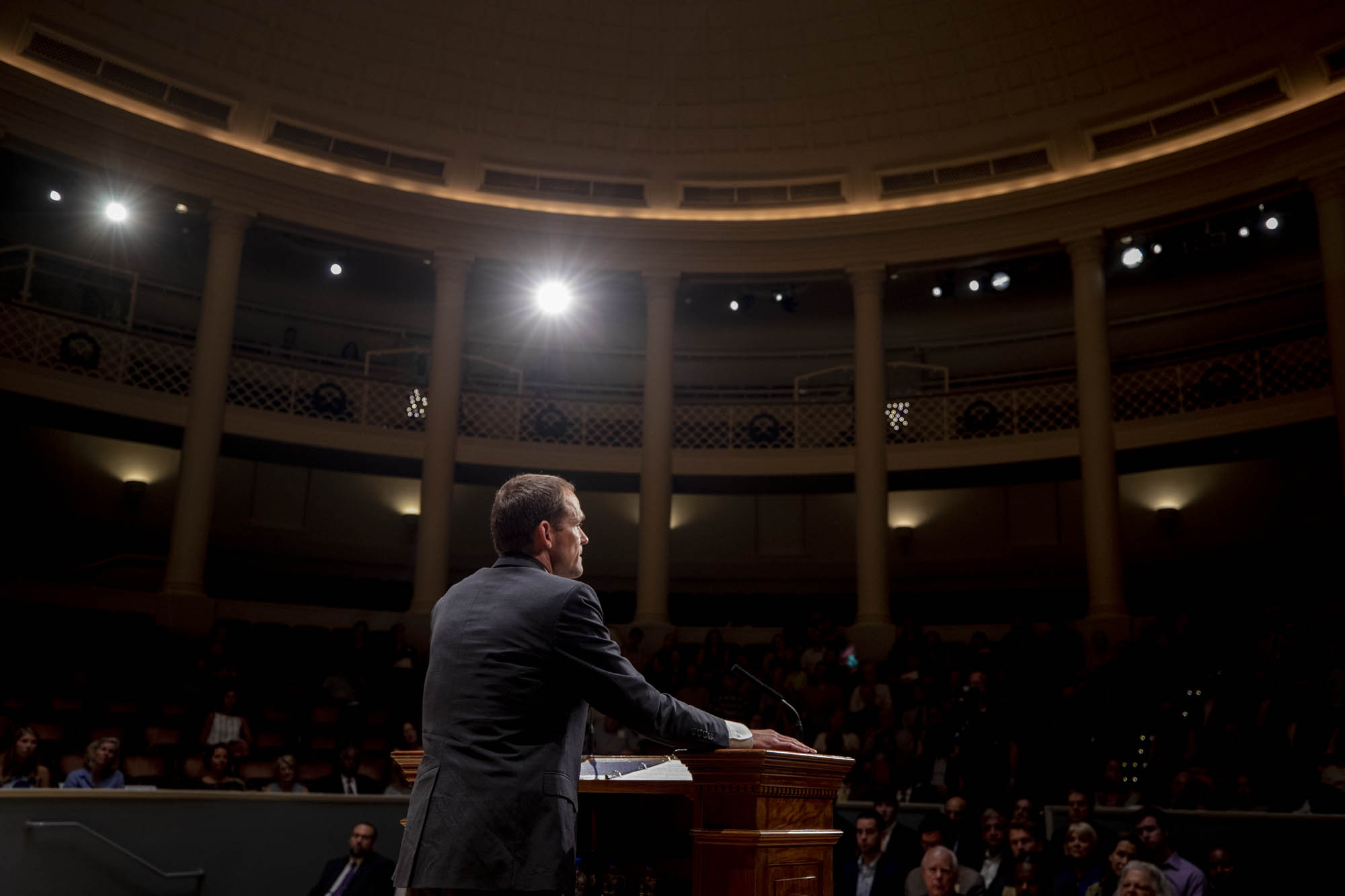 President Jim Ryan standing at a podium giving a speech to a crowd