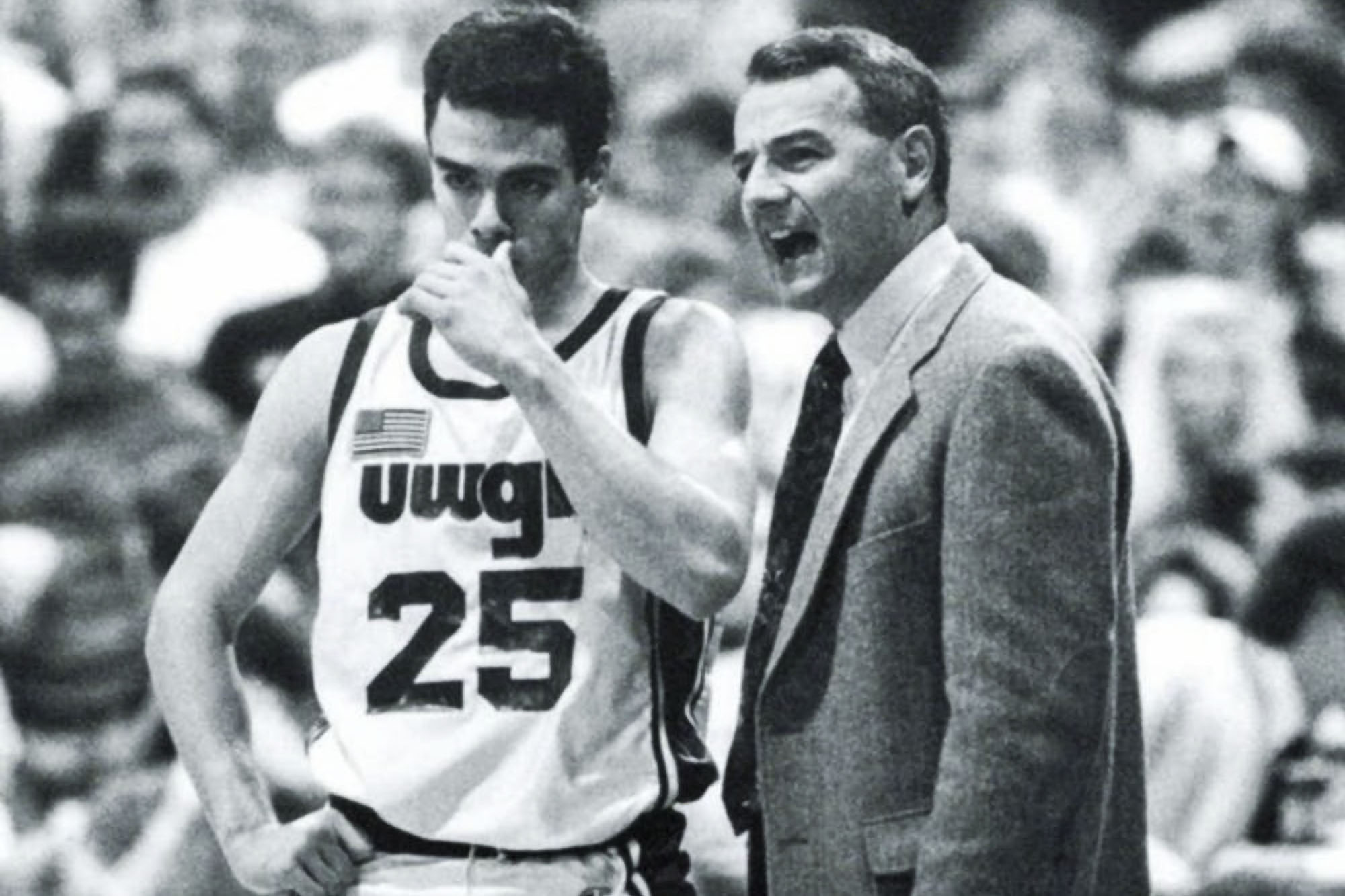 Tony Bennett, left, standing next to his basketball coach during a game