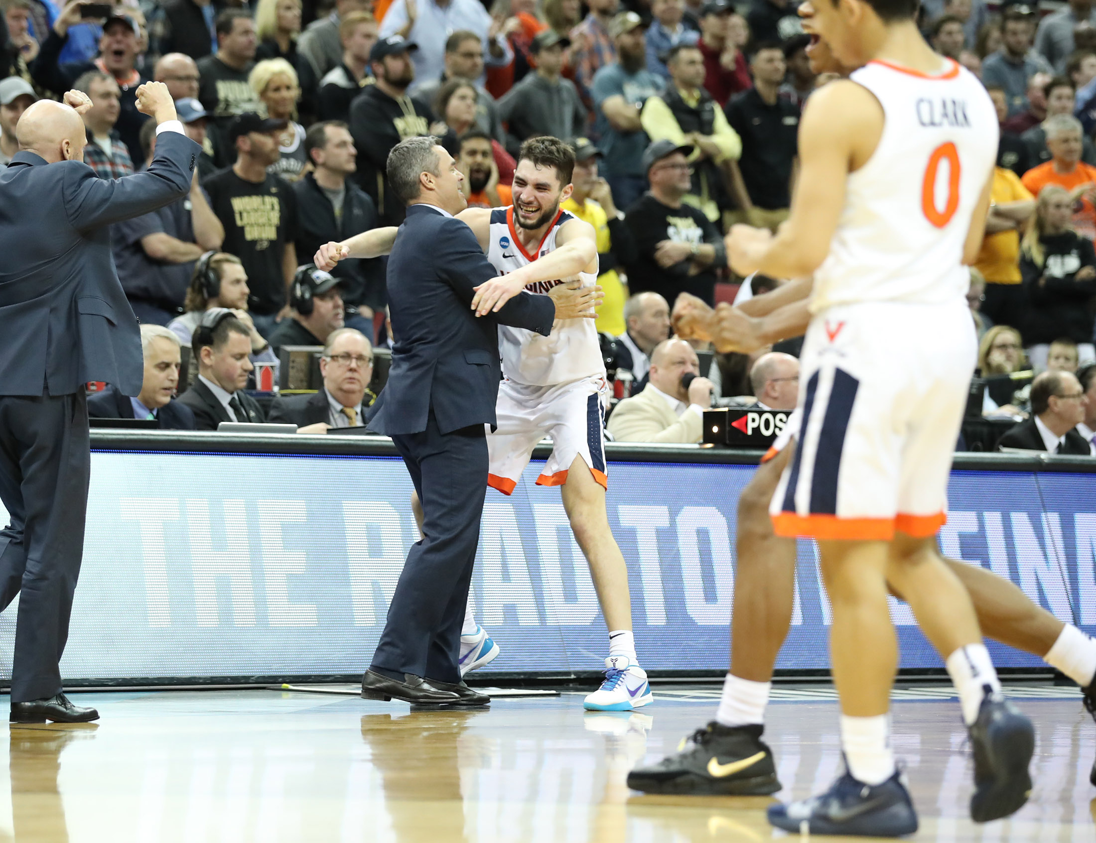 Tony Bennett hugging a player after wining the final Four