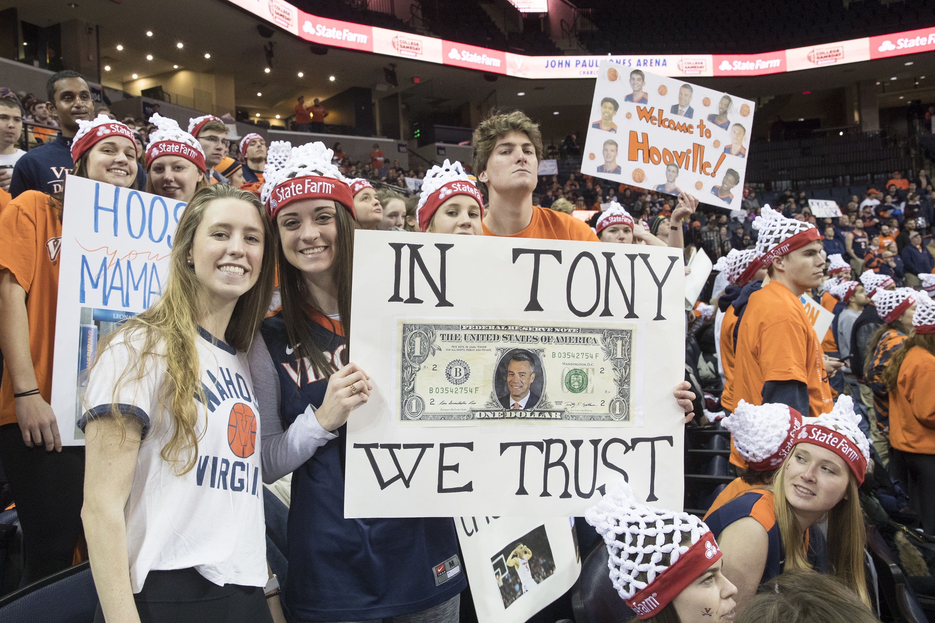 Fans holding a sign that says in Tony we trust