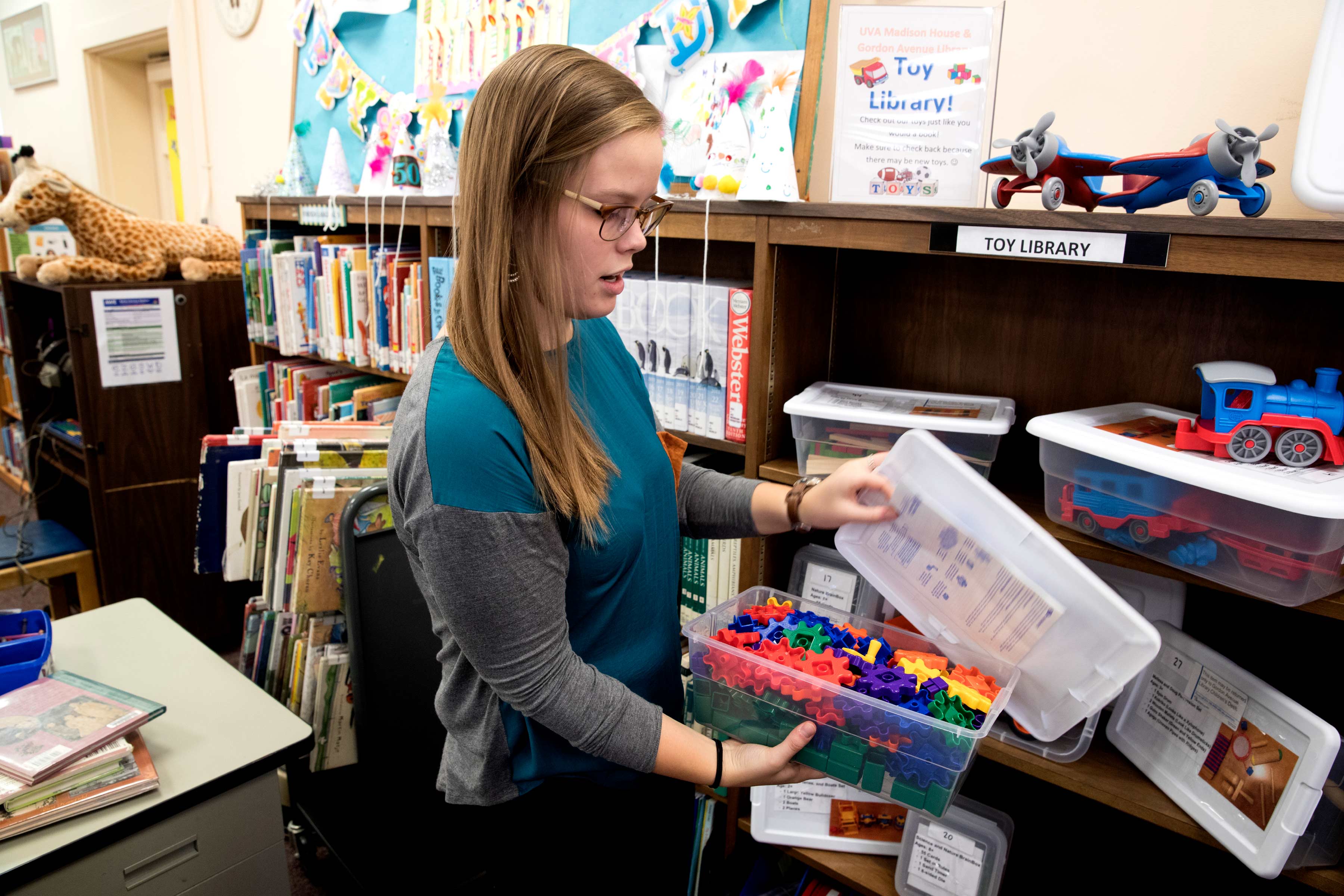 UVA student and program director Madison Lewis shows off the toy library. 