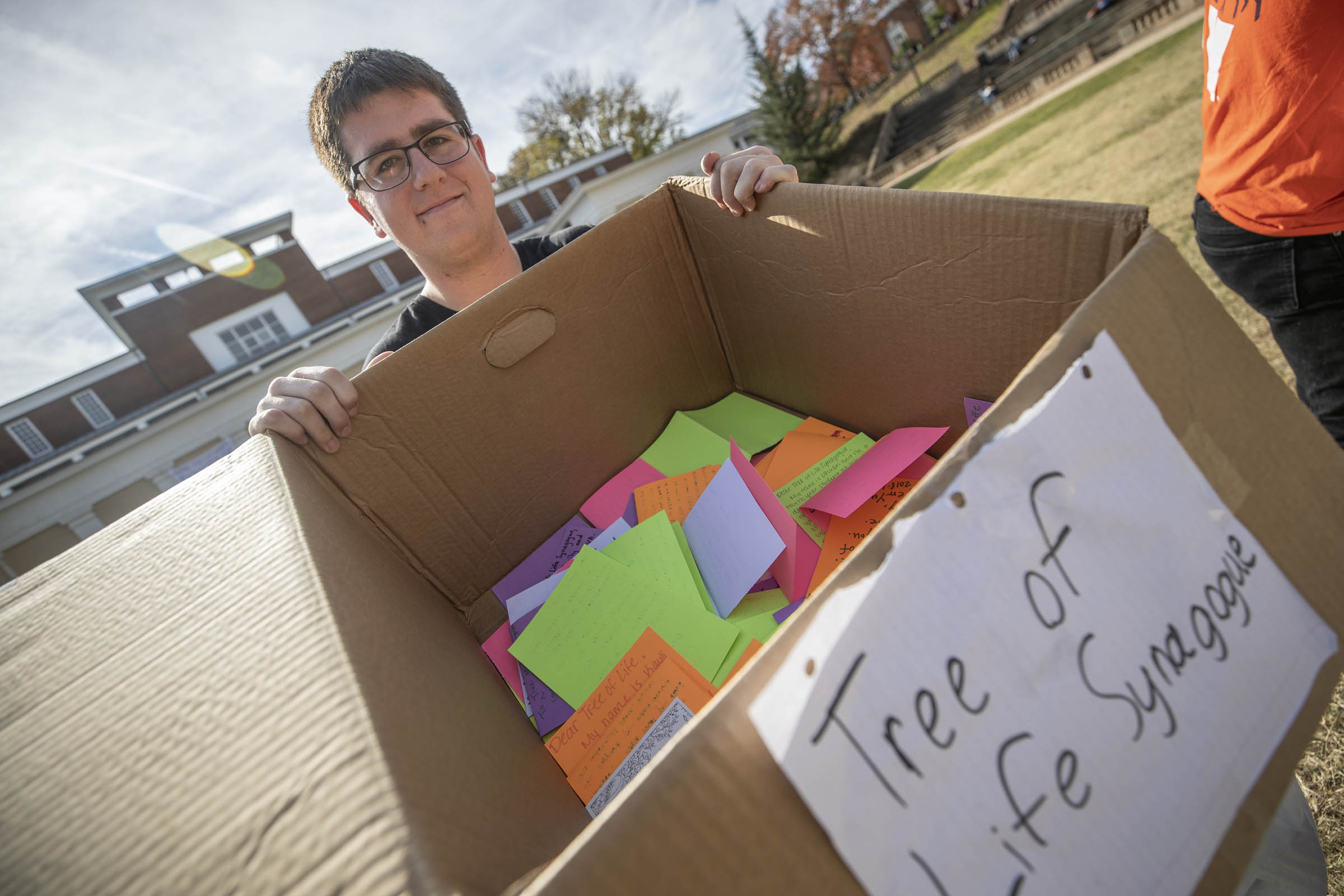 Ben Borenstein, who also helped organize the event, holds a box filled with letters bound for the Tree of Life synagogue.