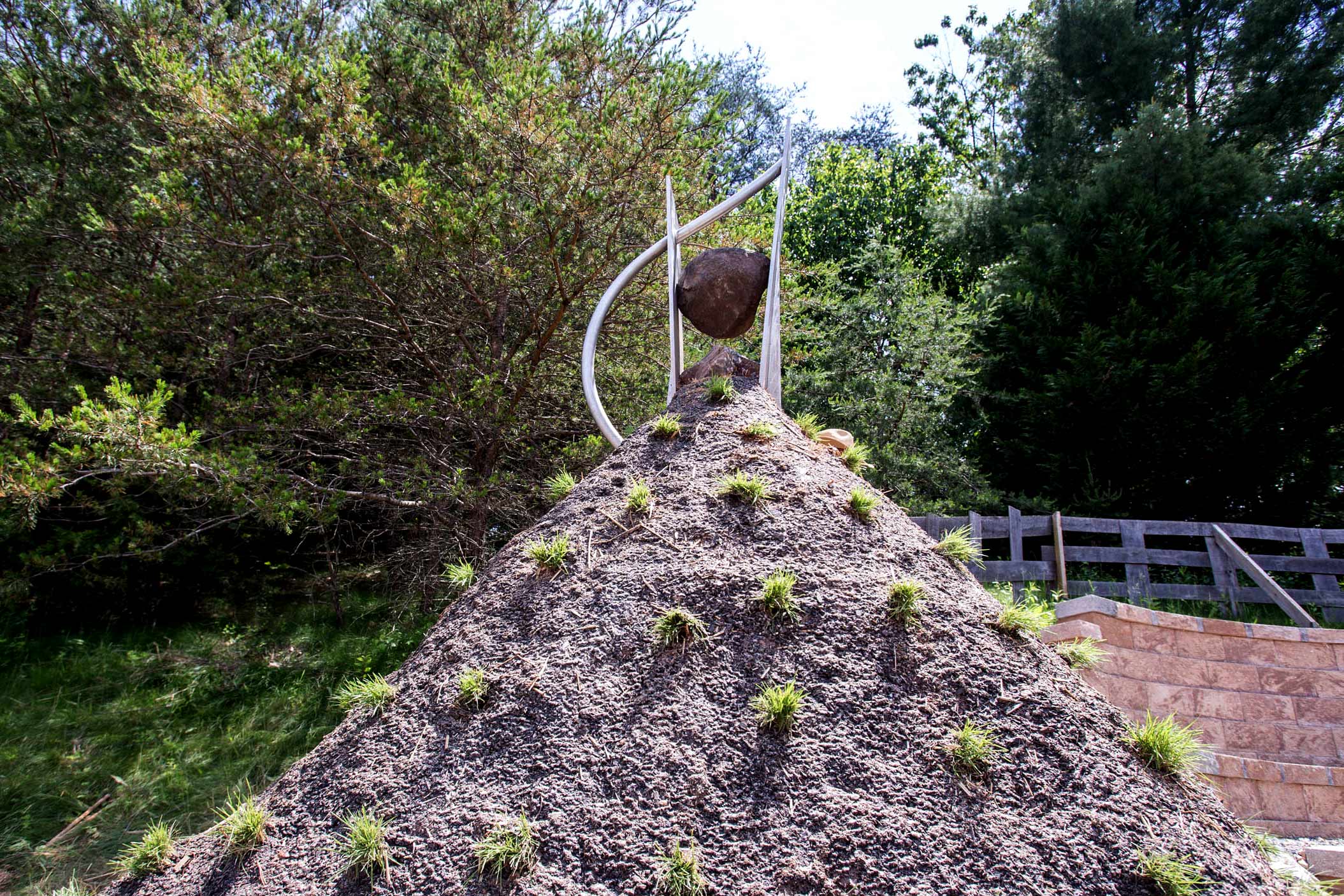 Only a few feet of Watson’s sculpture can be seen above the earthen mound containing more than 1,500 artifacts.