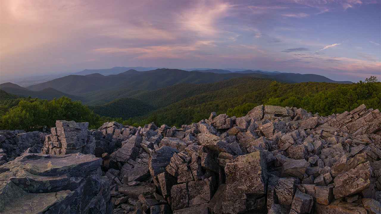 Tumbled rocks stacked on the top of Black Rock Summit as it over looks overlooks the Blue Ridge Mountains