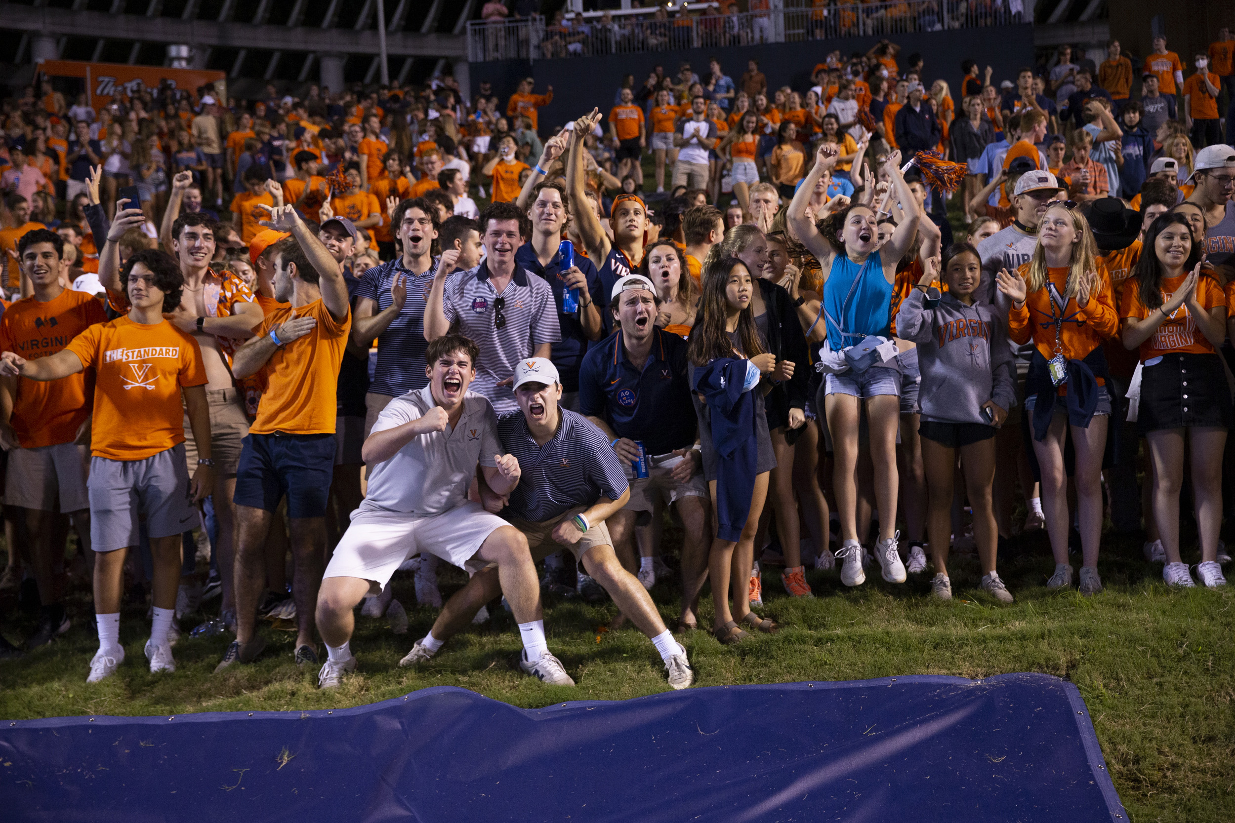 Group of students cheering from the hill at Scott stadium