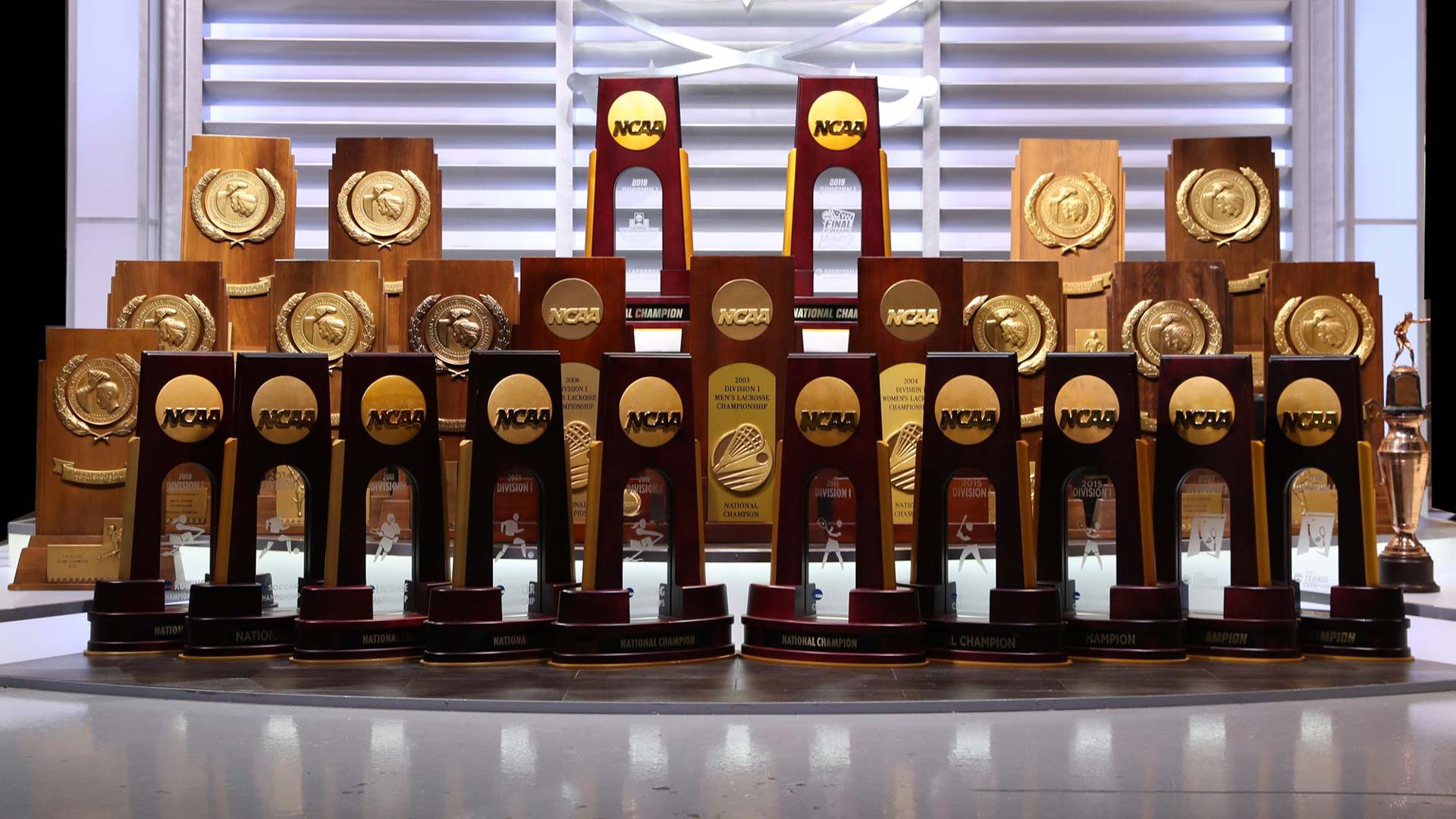 NCAA trophies lined up