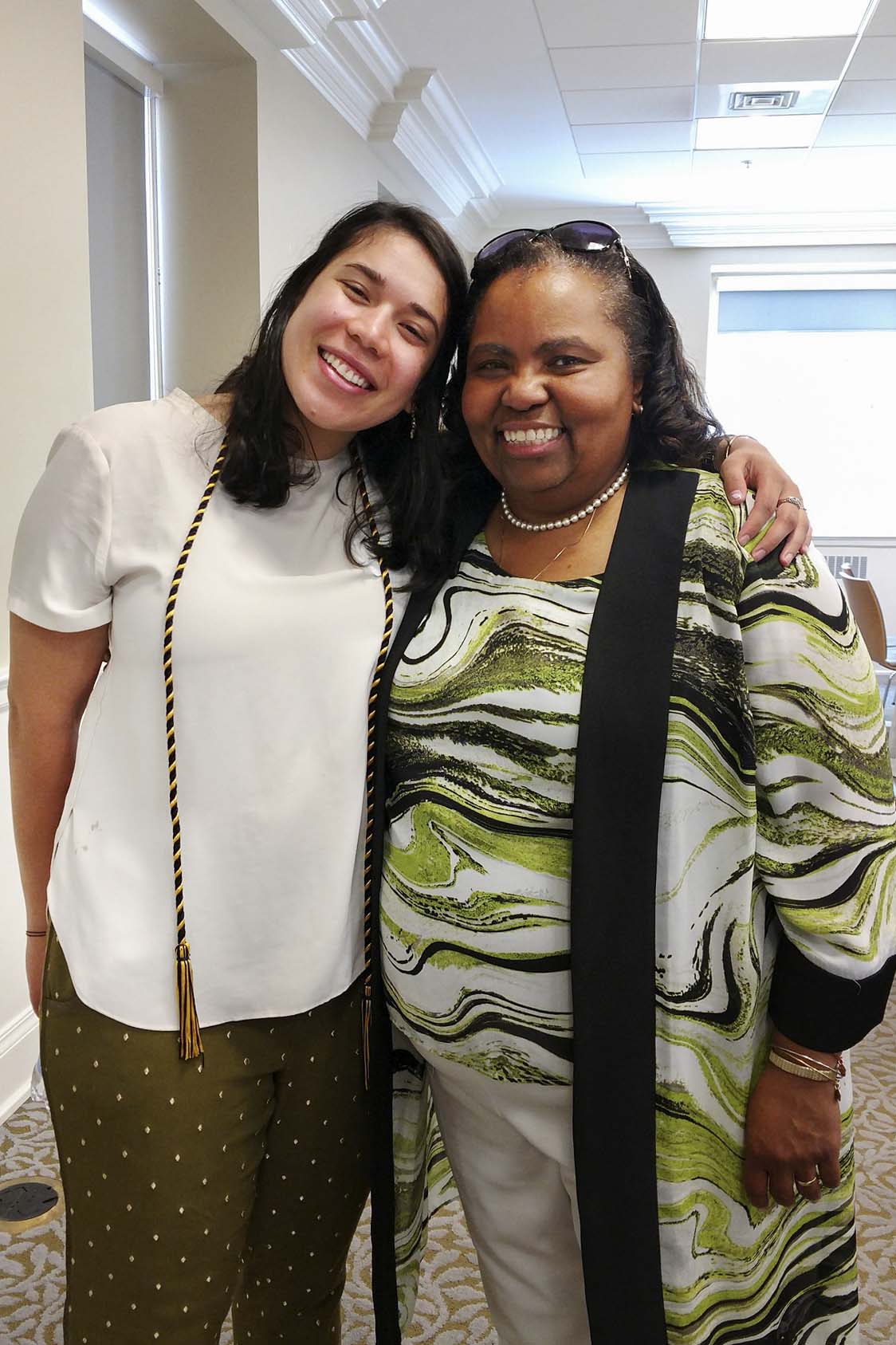 Kathryn Perez, left, and Valerie Gregory, right pose for a picture together