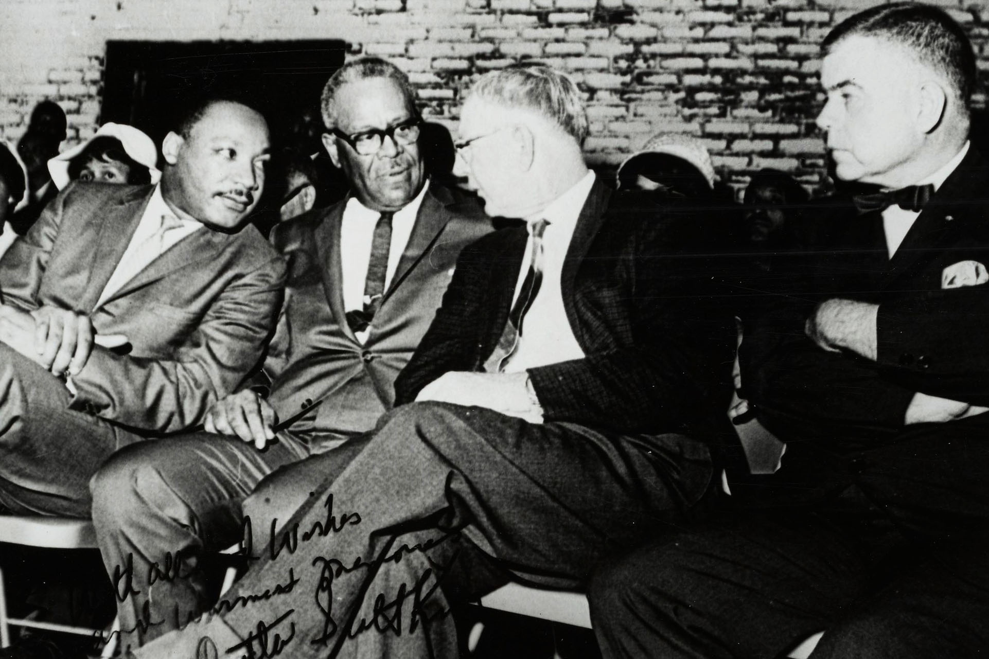 Walter Ridley, second from left,  speaking with Martin Luther King Jr, left, and two other gentlemen right