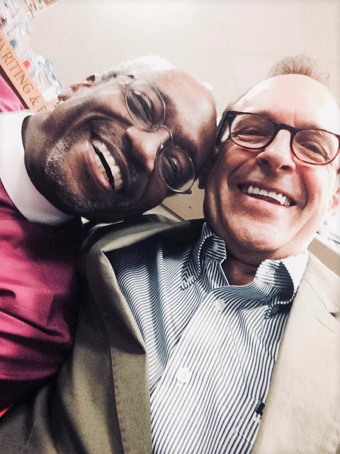 Charles Marsh, right, with Bishop Michael Curry smile during a selfie