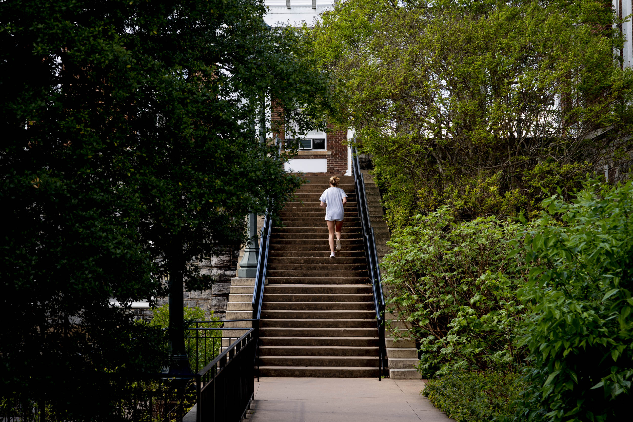 Person running up steps on Grounds