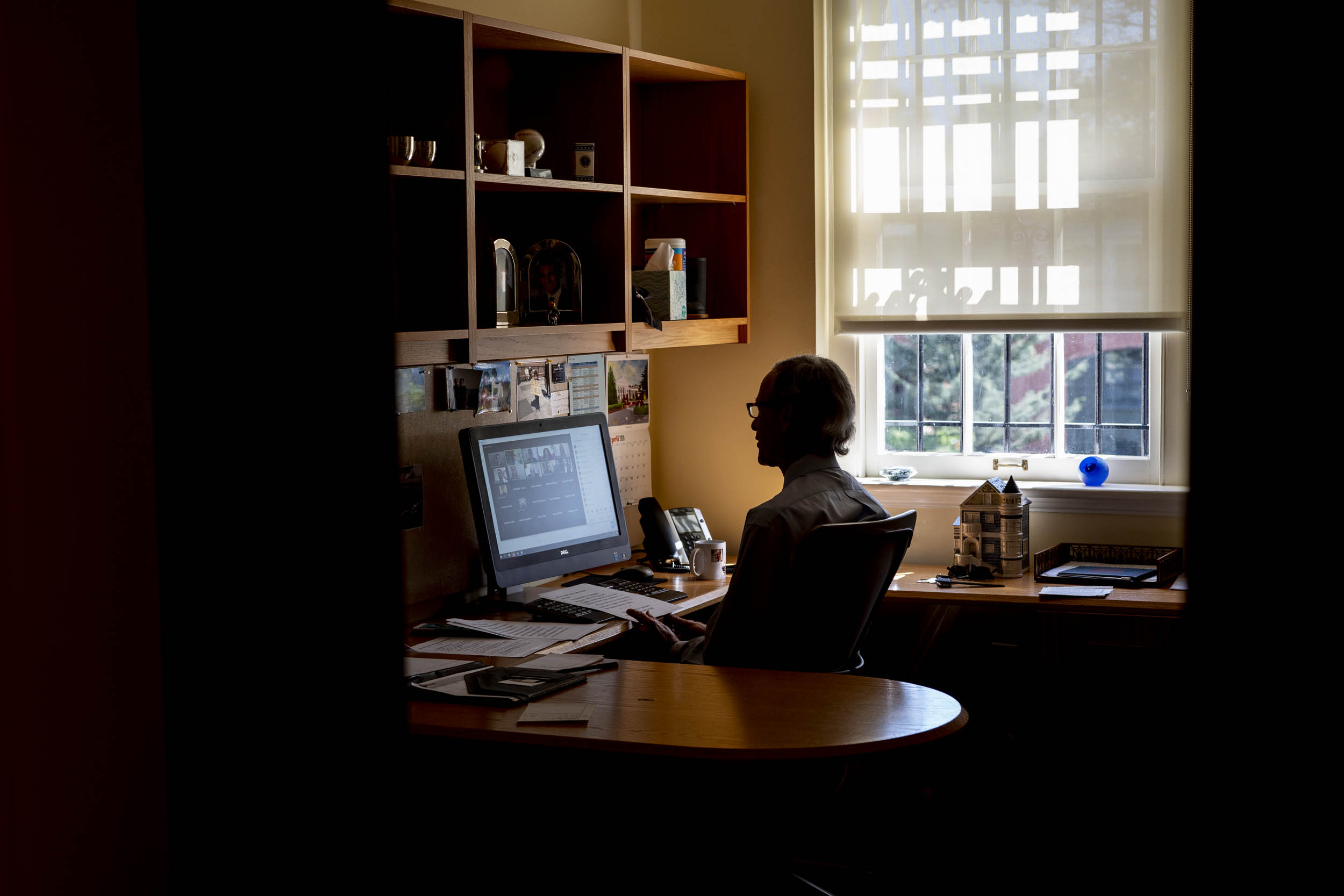 Man sitting at his desk in a zoom meeting