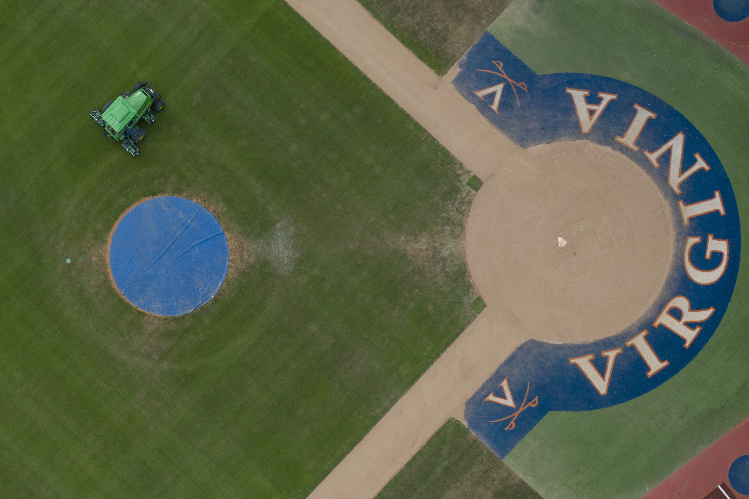 Aerial view of a mower mowing the baseball field