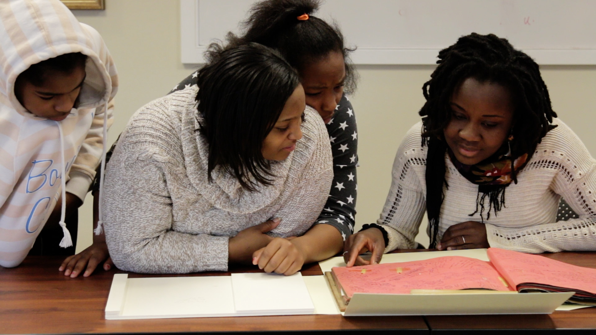 Abigail Kayser, right, mentors a group of local girls with City of Promise coach LaTara Ragland, center, pictured here with Walker School seventh-grader Tanjalir, left, and Buford eighth-grader Talejha, behind Ragland. (Photo courtesy of Light House Studio)