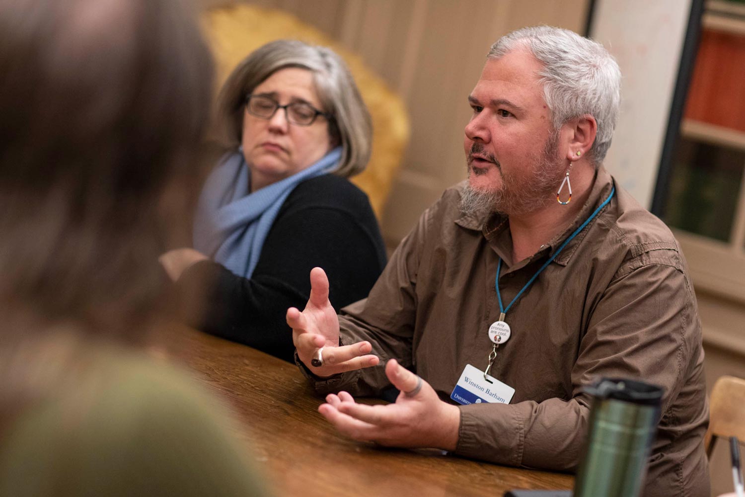 Winston Barham talks to a group of people at the table