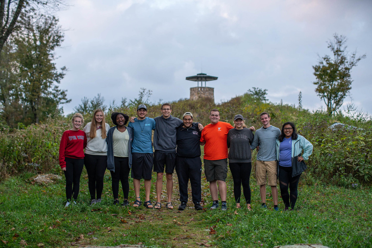 UVA wise students stand together after a hike to a lookout tower