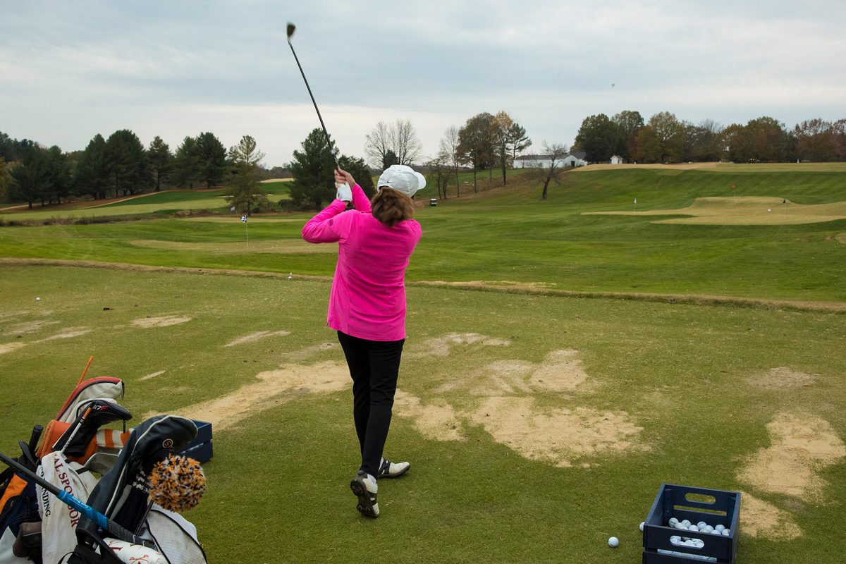 Sherri Moore golfing