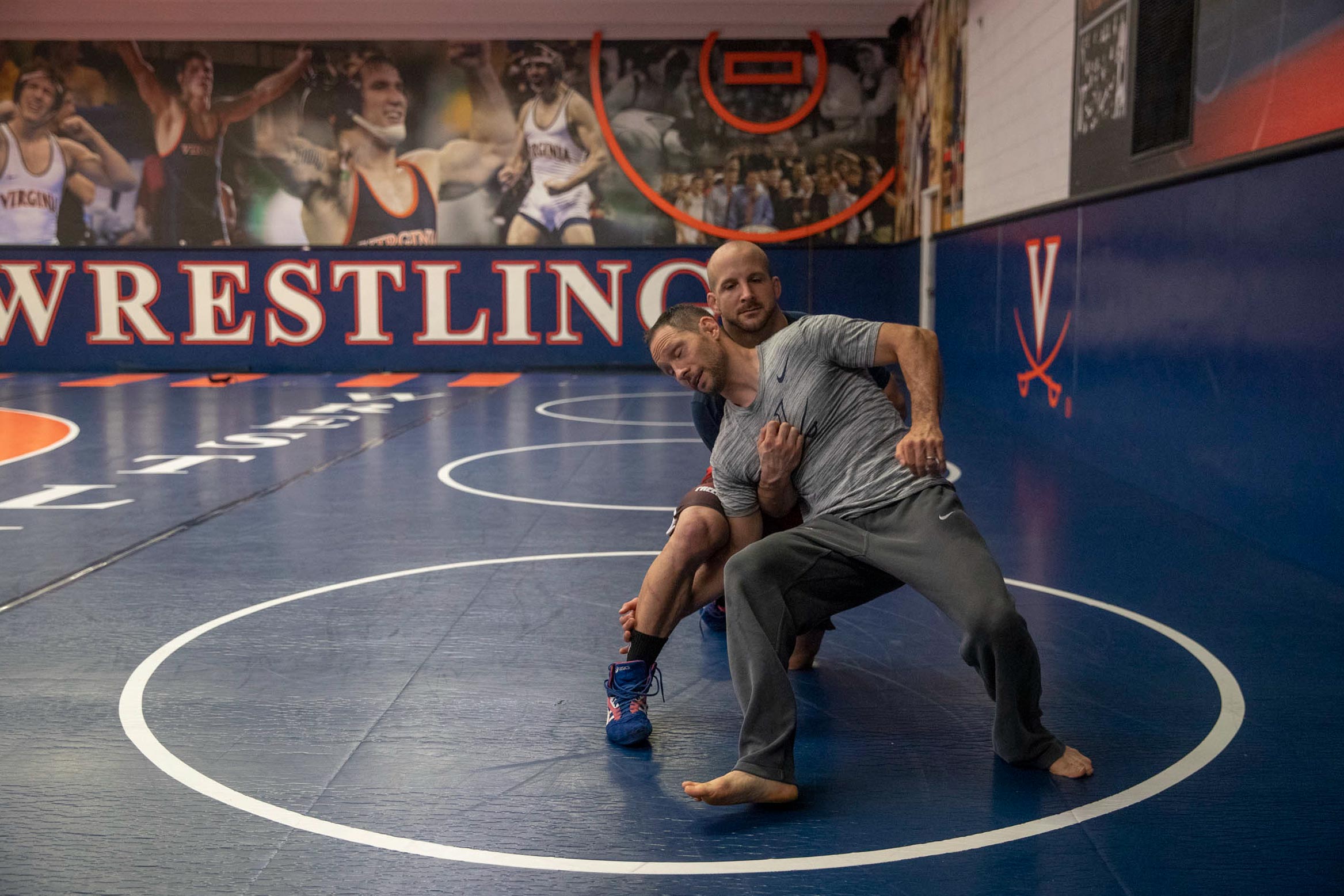 Steve Garland,front, and Trent Paulson, back, wrestle on a mat