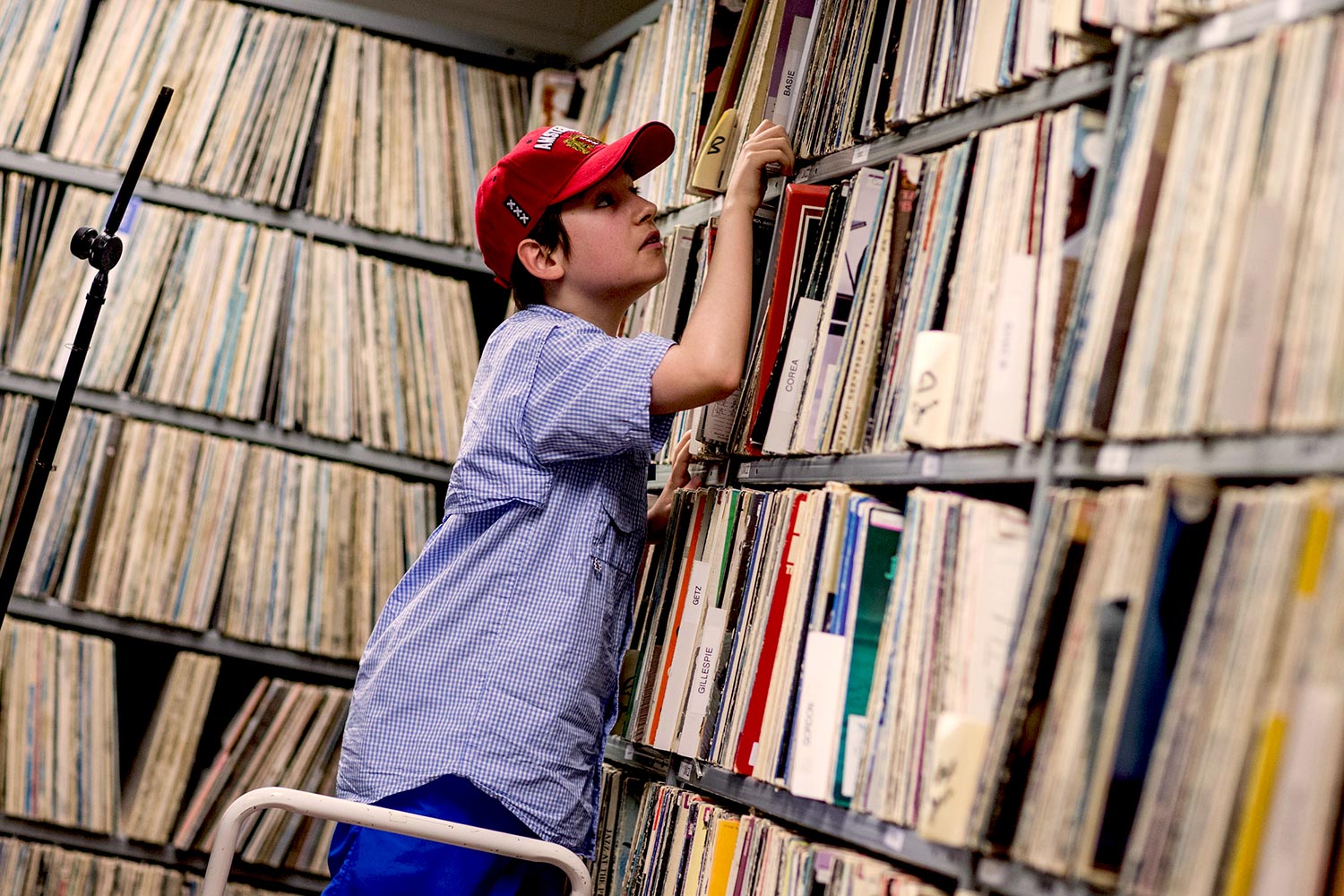 Camper Kieran Garrod searches for a record in WTJU’s extensive library of vinyl records.