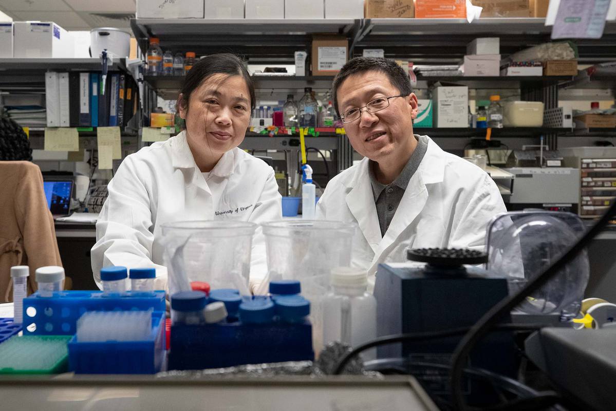 Ying Jiang, left, and Hui Zong pose for picture together in a lab