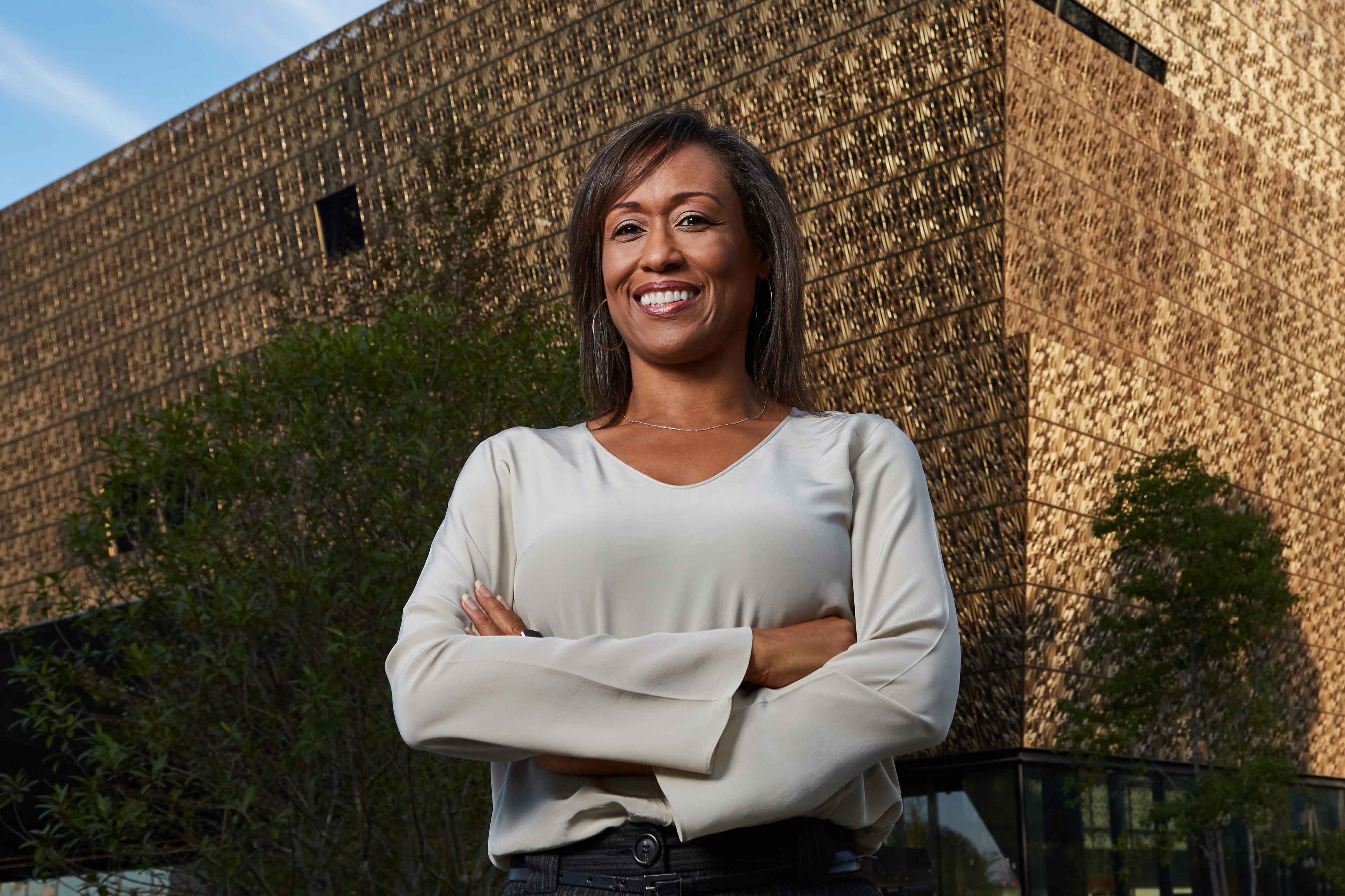 Architect Zena Howard in front of the new museum. (Photo by Alan Karchmer, courtesy of Freelon Adjaye Bond/SmithGroup)