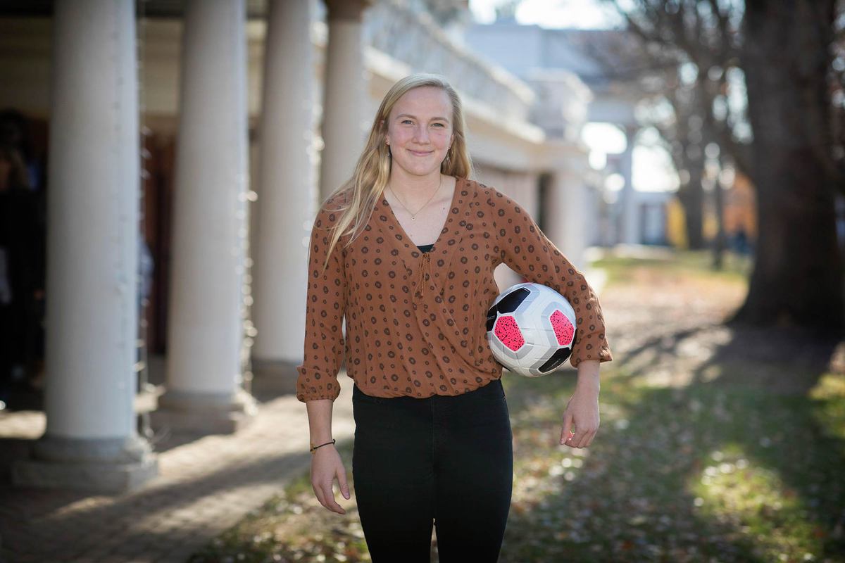 Morse standing on the Lawn holding a soccer ball