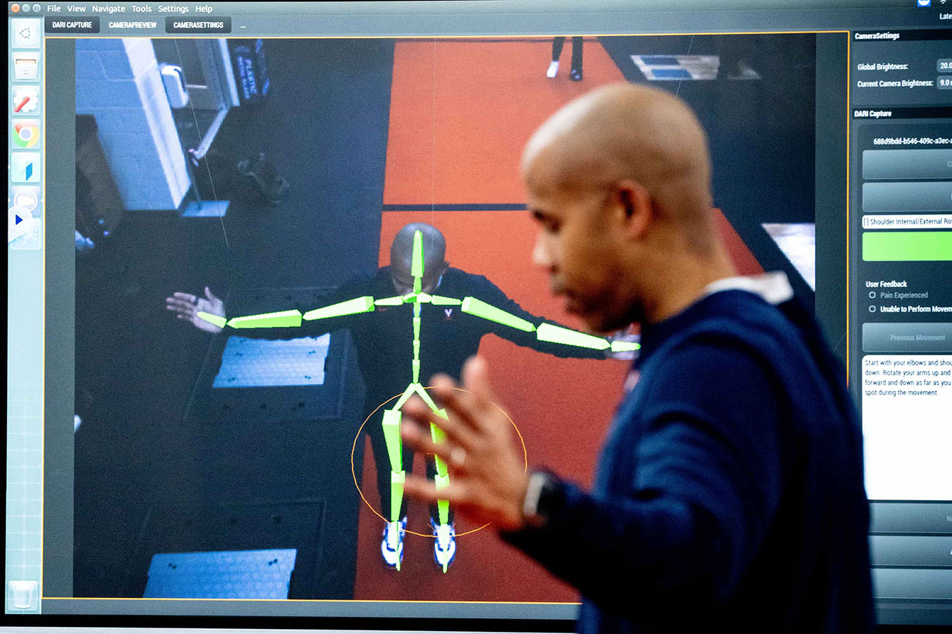 Mike Curtis showing the digital tracking of the equipment while standing