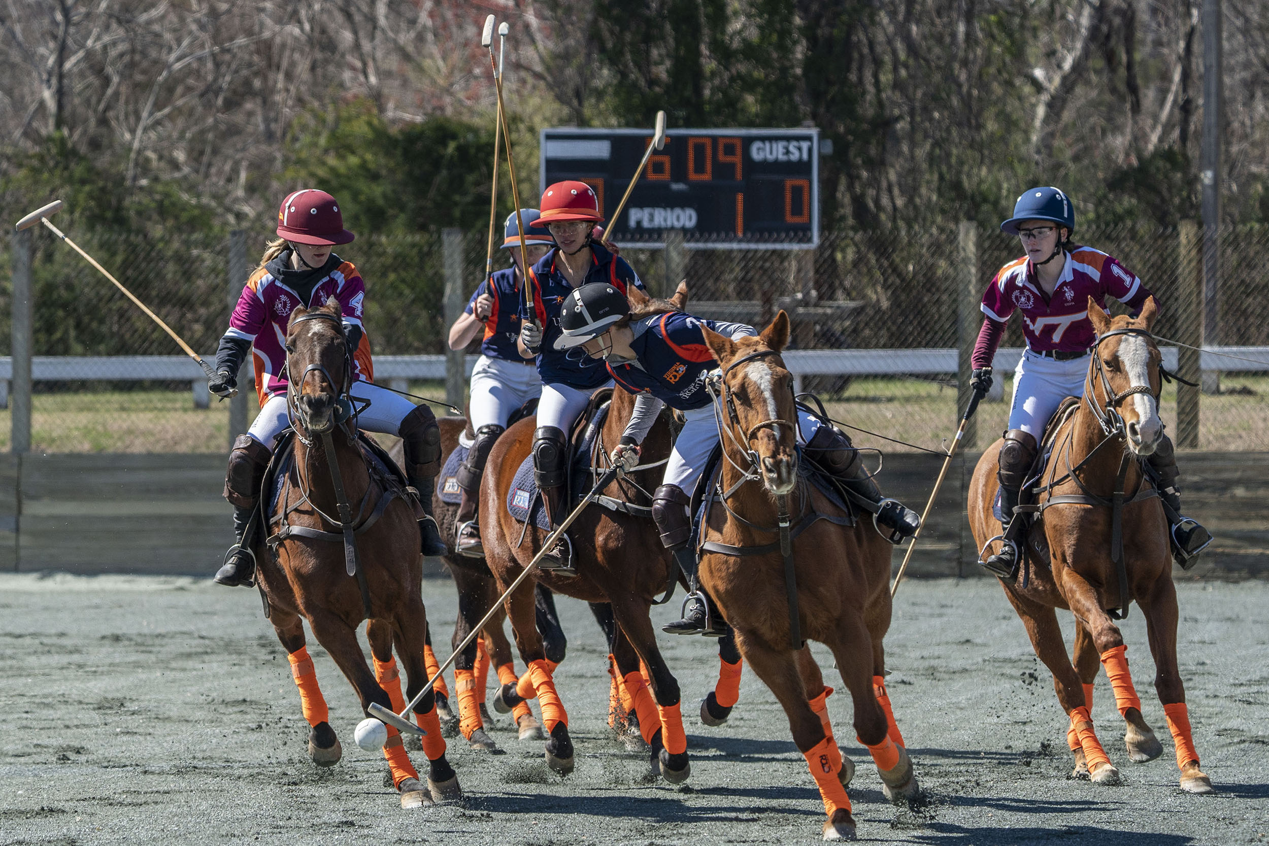 Club captain Parker Pearce blocks the ball on alumnus Jack McLean, while Connor Deal, Jim Deal and Vlad