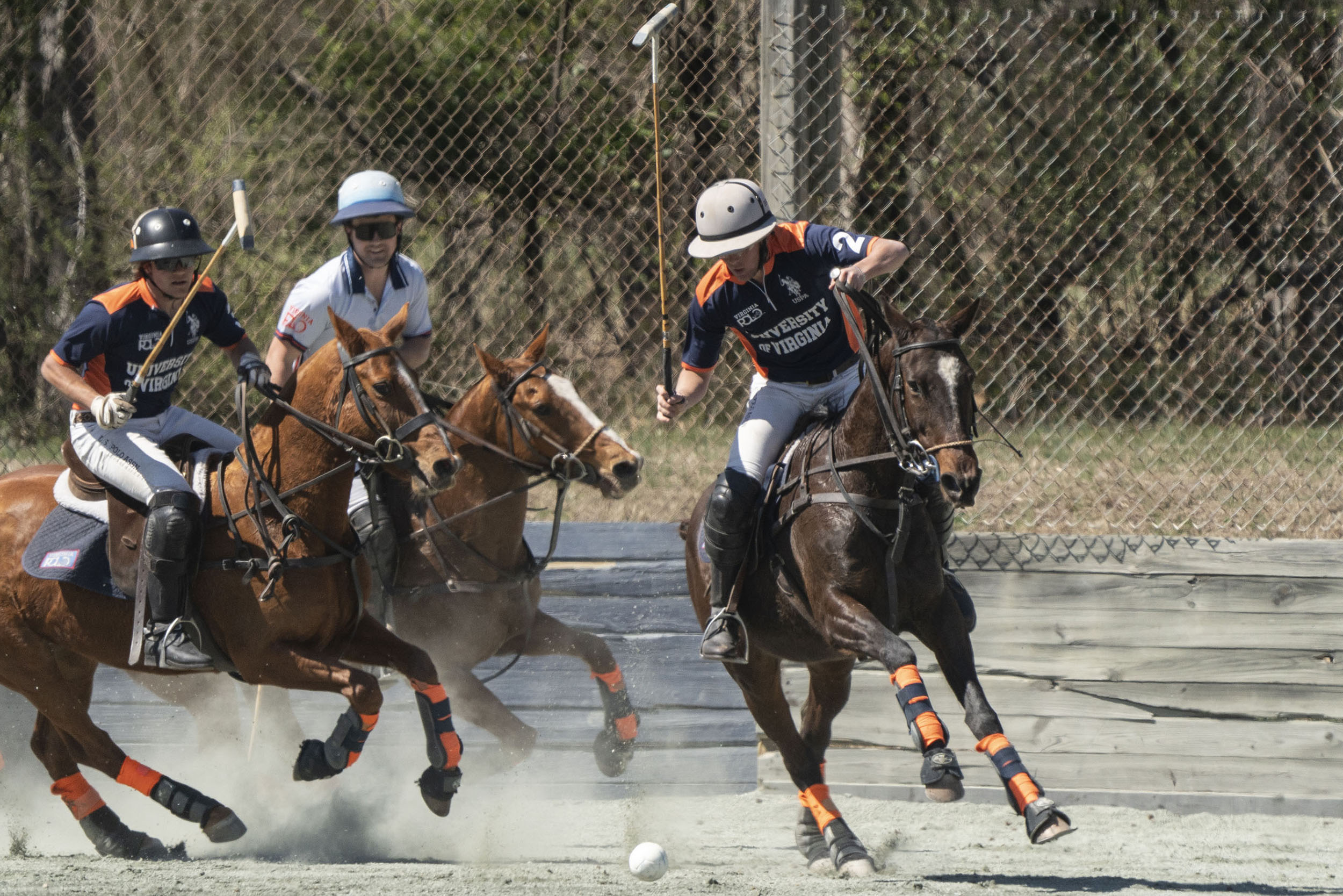 Parker Pearce and Connor Deal ride up behind while alumnus Jim Deal
